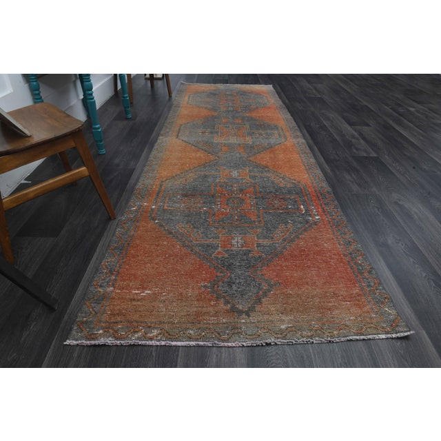 Vintage Hand-Knotted area rug is a semi-antique vintage area rug. The '70s Eastern region of Anatolia's unique rug is...