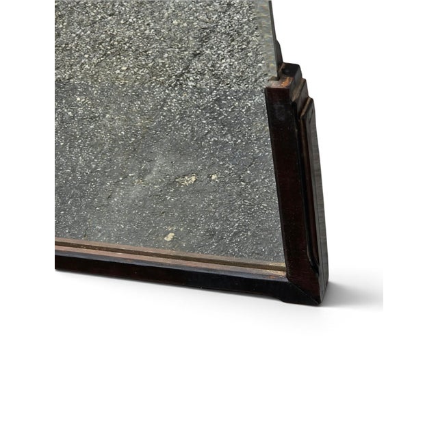 The 1920 Art Deco Walnut Mirror is a vintage piece with a classic rectangular shape and a mirrored frame finish. This...