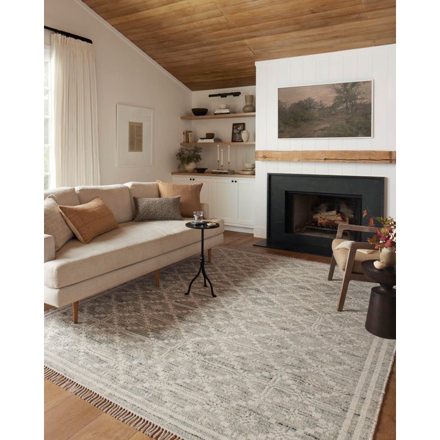 The Rivers Collection by Angela Rose x Loloi is a modern flatweave area rug with a reversible design featuring symmetrical...