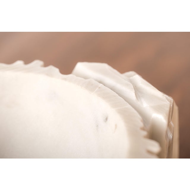 This is a small Italian valet tray, what the French call a vide poche, literally "empty pocket", carved from Carrara...