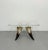 A striking vintage side table featuring a thick square Lucite top supported by four sculptural natural horn legs with rich...