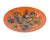 A Mid-Century orange enamel plate with vibrant splashes of color. The underside and rim of the plate are black. The entire...