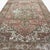 This vintage Heriz rug, approximately 80 years old, showcases the distinctive geometric character of traditional Heriz...