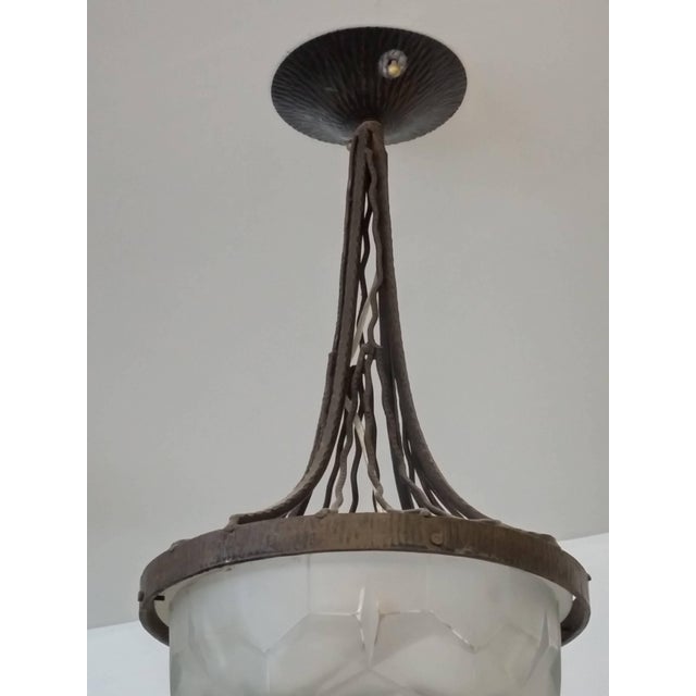 French Art Deco wrought iron pendant chandelier designed by the French Artist " DEGUE " There are in their original state...