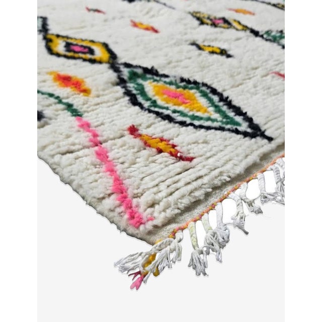 Handwoven Azilal Rug – Moroccan Berber Wool Rug This handwoven Azilal rug blends traditional Amazigh symbolism with a soft...
