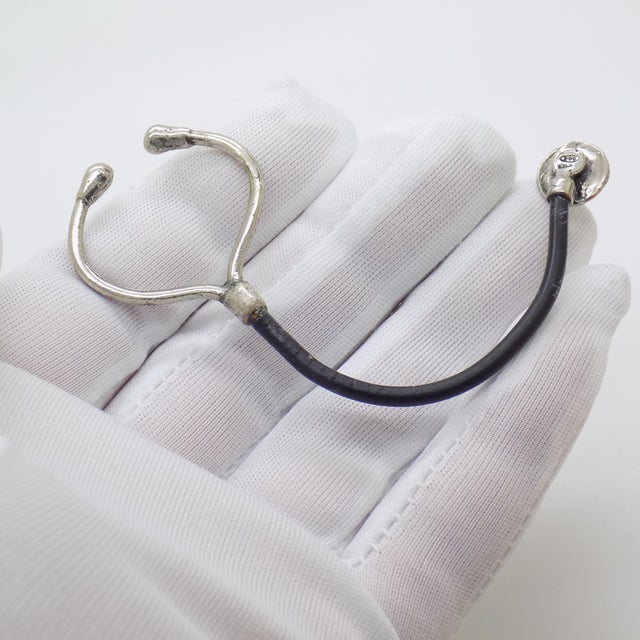 This lovely silver stethoscope dollhouse miniature, crafted in Italy during the 1980s/1990s, is hallmarked 800 (indicating...