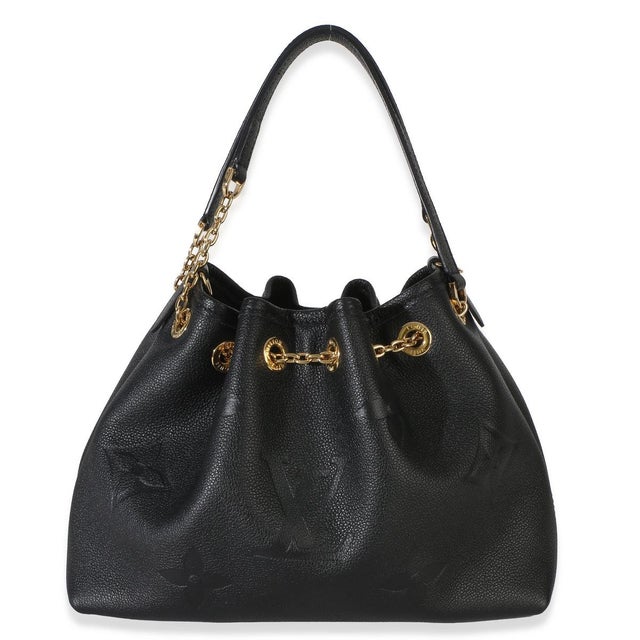 Item #: 154737 Interior Material: Microfiber Dimensions: 11.25 x 8.25 x 3.75 in Handbag Closure Type: Drawstring Handle...