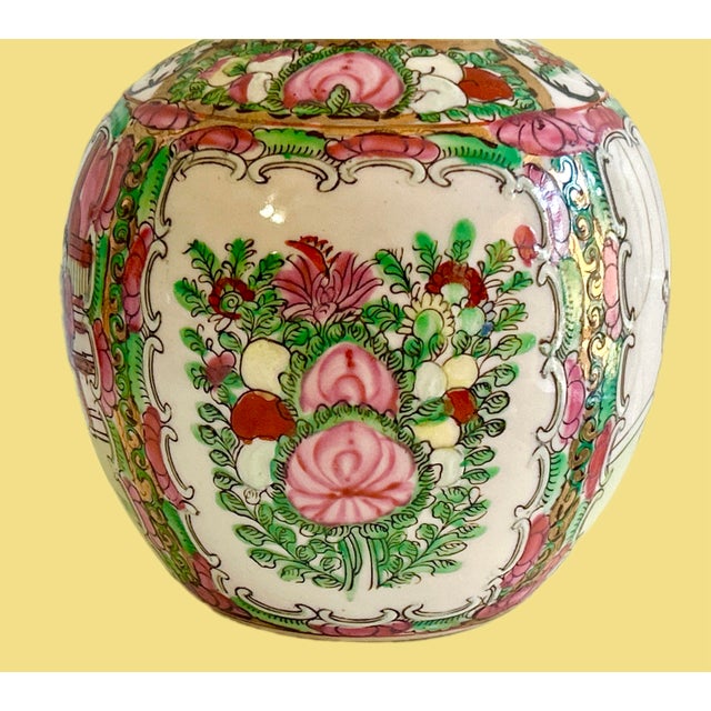 Vintage Chinese Famille Rose ginger jar or round vase, often referred to as Rose Medallion porcelain. It features...