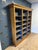 A beautiful, large antique open bookcase made of satinwood. Features adjustable shelves. The interior of the bookcase has...