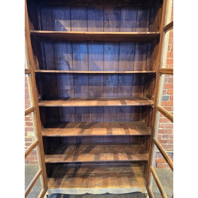 This beautiful, solid wood display cabinet offers a perfect blend of rustic charm and functional storage. Featuring a...