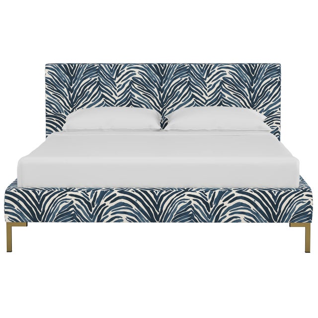 This low profile fully upholstered platform bed is a perfect piece for anyone looking to add a modern statement piece to...