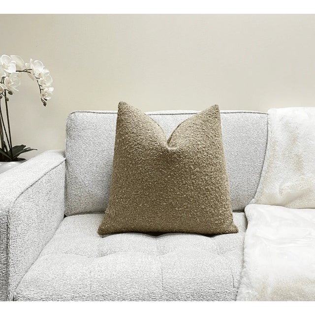 Add texture and style to your space with this beautiful double sided tan beige boucle pillow. Boucle is the fabric of the...