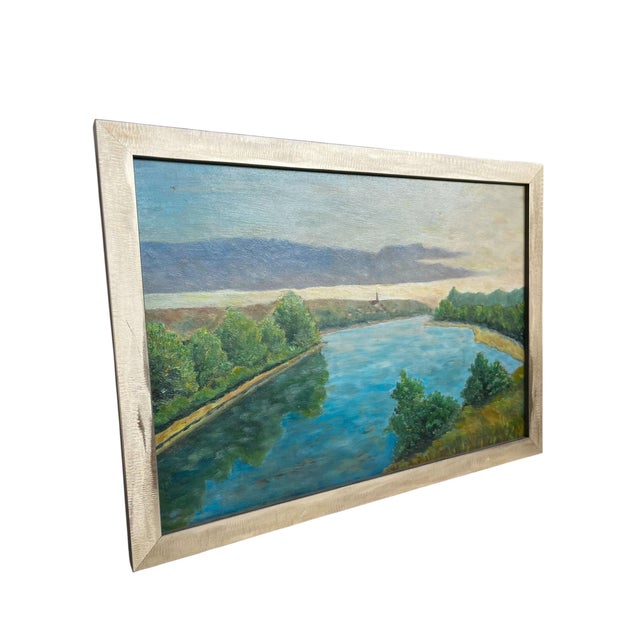 A serene vintage Italian landscape painting capturing the quiet beauty of a winding river beneath an expansive sky. Rich...