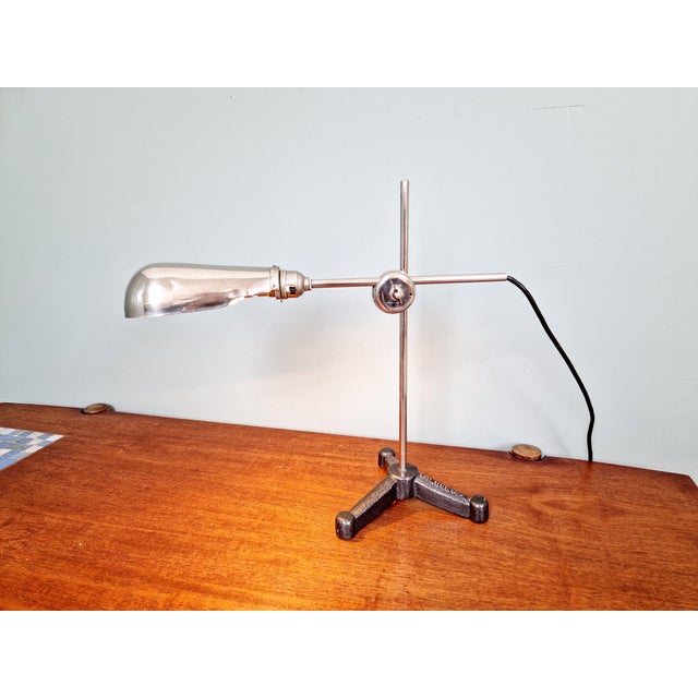 Rare articulated chrome-plated metal work lamp with a cast iron tripod base dating from the 1920s. this lamp was produced...