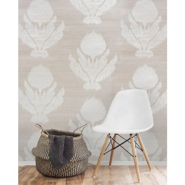 The soft edges of this floral pattern evoke the feathery designs of traditional ikat weaves. Printed on natural and...