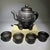 This is a striking vintage-style tea or wine set, meticulously carved to resemble dark horn, featuring an elephant motif...