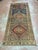 Antique Turkish runner, hand knotted in Turkey from 100% wool. Measuring 5’3” x 11’10”, this long and narrow rug features...