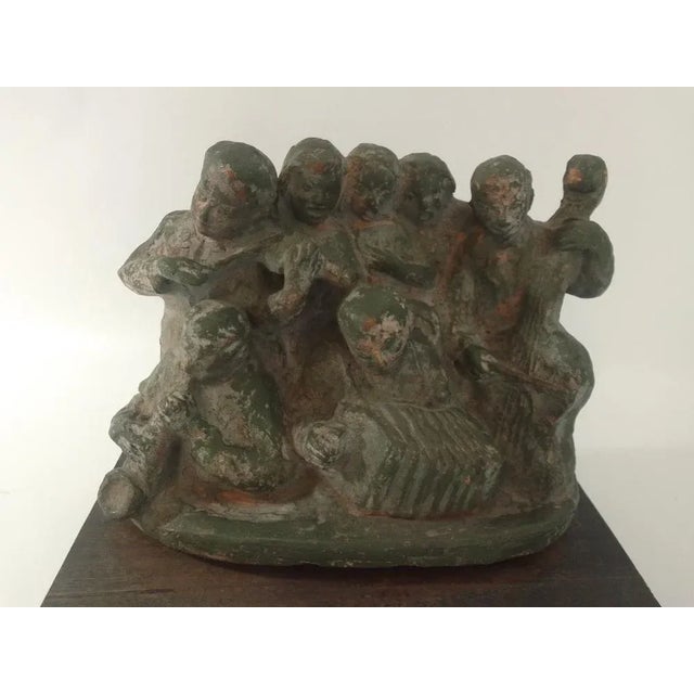 The sculptural group is made of painted terracotta and depicts musicians with accordions. It is presented with an original...