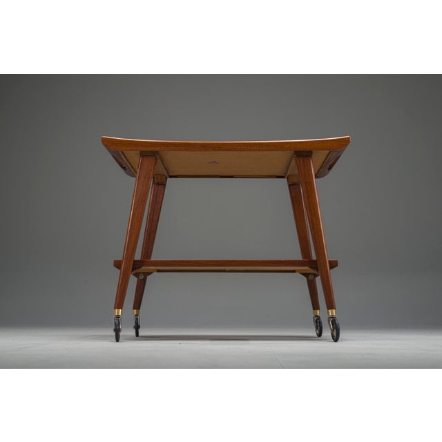 Elegant German mid-century bar cart by Opal Kleinmöbel, dating from the 1960s. A refined and functional piece...