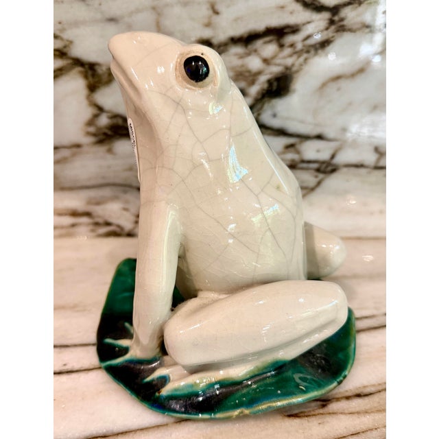 Stunning Italian majolica crackled glazed frog figurine over a lotus leaf.