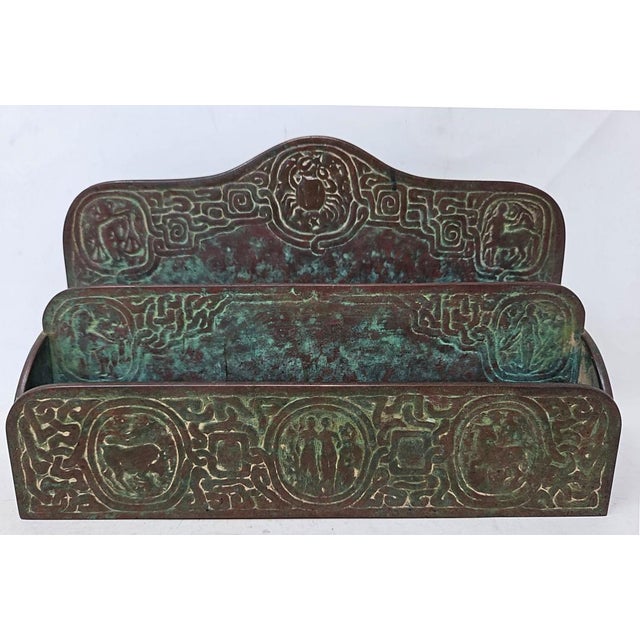 Here is an antique Tiffany Studios New York bronze 2-tier zodiac letter rack made in the early 1900s. The art deco style...