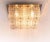 Elegant large cubist flush mount ceiling lamp with sixteen large glass blocks with a textured structure fixed on a golden...