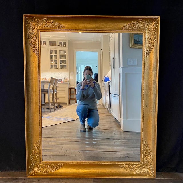 Large scale French Empire style mirror with beautiful neoclassical embossed motif in classic French form. Will add...