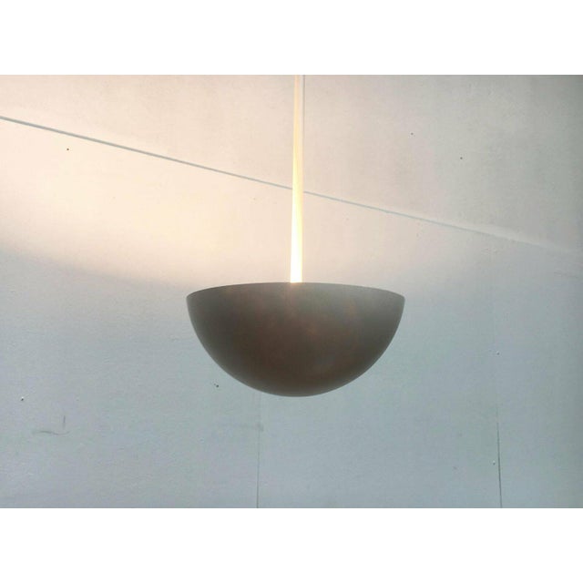 Elegant rod pendant lights with fiberglass reflectors. A minimalist design language with a matching color scheme in white....