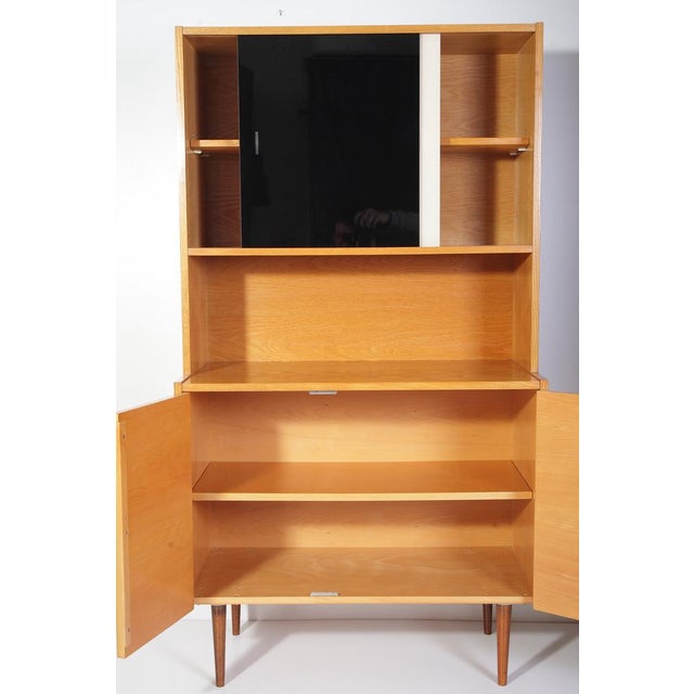 Completely restored beautiful subtle 147 cm high cabinet in ash wood veneer. Clean, close to perfect condition. Only very...