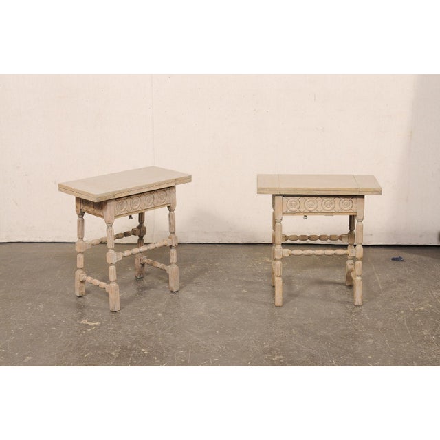A French pair of carved and painted wood side tables, with transitional/fold out tops, from the turn of the 19th and 20th...