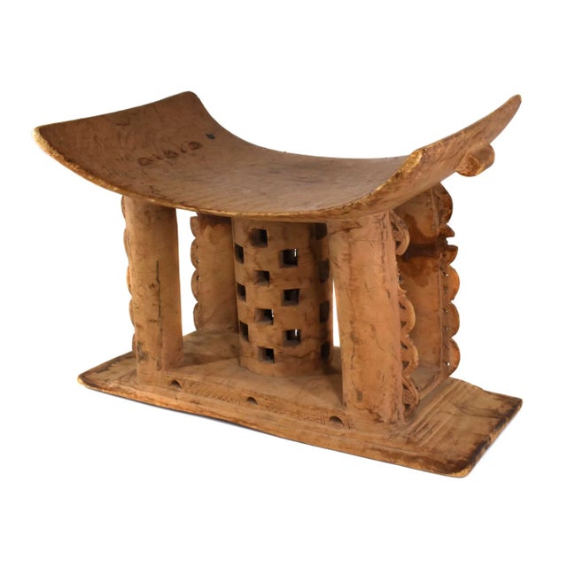 A well-designed stool from the Asante people. Among the Asante, an elaborate stool like this serves multiple purposes in...