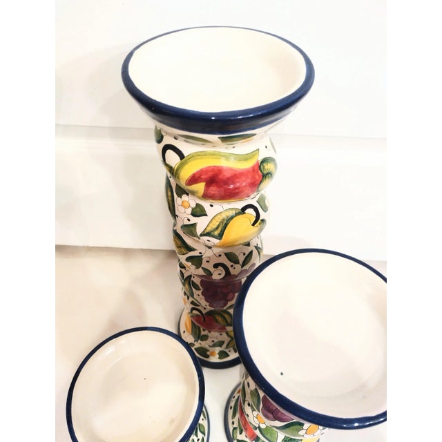 A beautiful set of 3 large twisted fruit design pillar candle holders. The candle holders are made in Mexico but have a...
