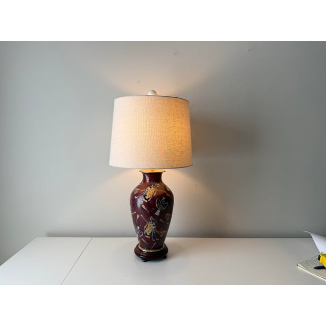 Vintage Wildwood golf club and caddy painted porcelain table lamp on wood base with neutral linen lampshade.