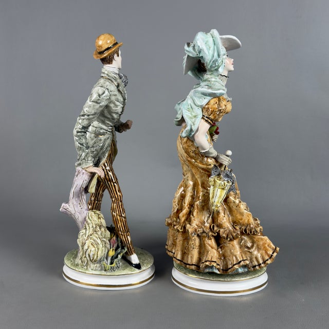 A spectacular sculptural ensemble composed of a pair of fine polychrome porcelain figures, crafted by Liani Italy in the...