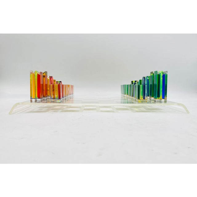 A rare and visually striking Lucite chess set designed by Charles Hollis Jones, a celebrated American designer known for...