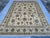 This elegant hand-knotted wool area rug showcases a sophisticated Oushak design with a timeless Chobi finish. The large...