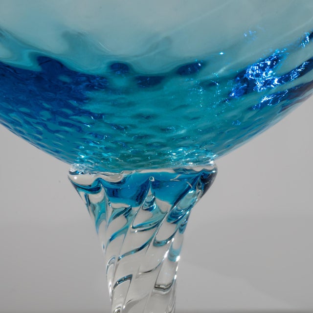 Discover a piece of history with this exquisite 1960s Italian Blue Glass Goblet, a testament to timeless craftsmanship....