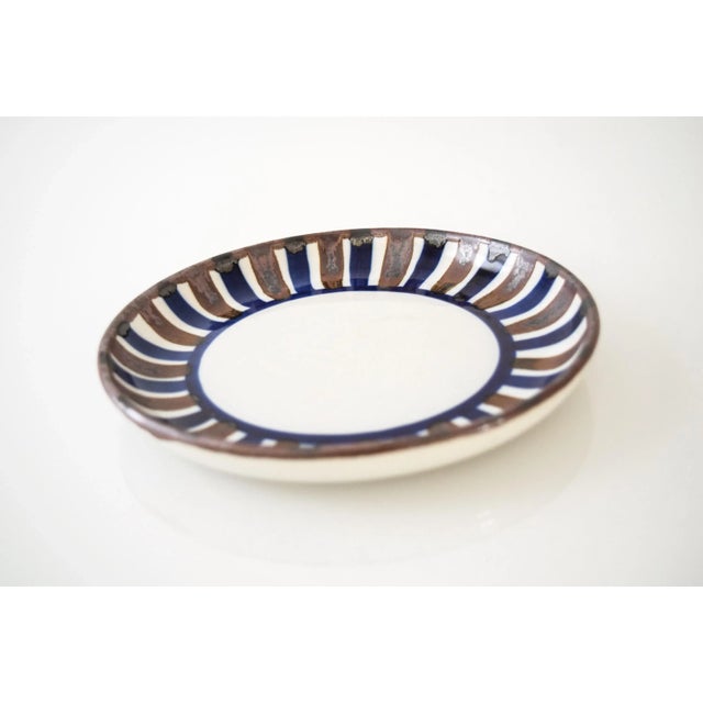 This vintage Danish modern Dansk small ceramic dish or bowl features a lovely shallow profile and a simple modernist...