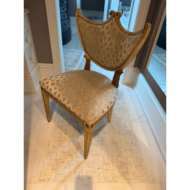 This elegant Dixie & Grace shield‑back occasional chair, purchased at the Merchandise Mart, showcases the brand’s...