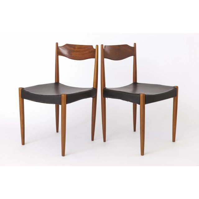 Pair of Vintage Dining Chairs Originating from the 1960s, this elegant pair of dining chairs offers a blend of timeless...