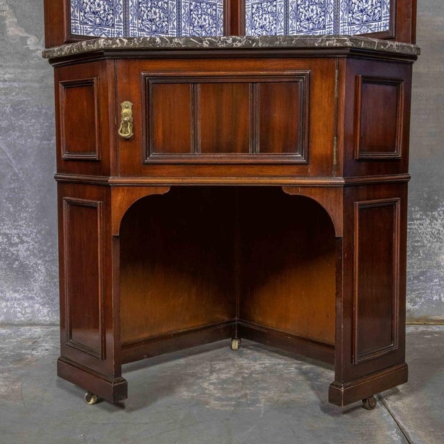 A lovely high quality antique corner marble top washstand with very attractive blue and white tiles (likely to be Minton)...