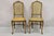 Antique French Provincial Louis XV Style Carved Walnut Cane Dining Side Chairs - a Pair. Item features cane back and seat,...