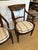 Beautiful pair of Italian dark walnut armchairs having carved wood decoration in the tops with gestural swans. Seats are...