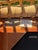 Early 21st Century Palecek Aries Coastal Rattan Lounge Chair With Tan Upholstery For Sale - Image 5 of 6