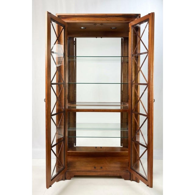 Fine late 20th-century lighted display cabinet or vitrine by Hickory White Furniture Company. Crafted with exceptional...