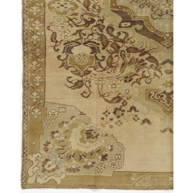 Character, tradition, pattern and palette converge in this gorgeous hand-knotted vintage Turkish Oushak rug.