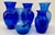 Stunning set of 5 vintage cobalt blue vases in various sizes. The vases can be used in various settings. Largest, 6.5" Dia...
