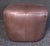 Plush vintage modern ottoman upholstered in a rich brown leather. Versatile size and shape allows it to be used...