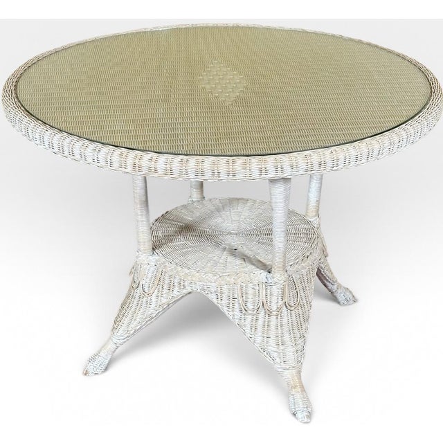 Vintage Coastal White Wicker Round Dining Table With Inset Glass Top This charming vintage white wicker round dining table...