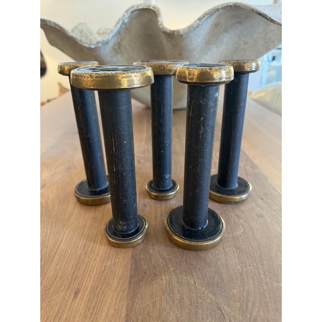 Vintage black and brass bobbins, set of five (5). These industrial thread bobbins have an amazing patina on both their...